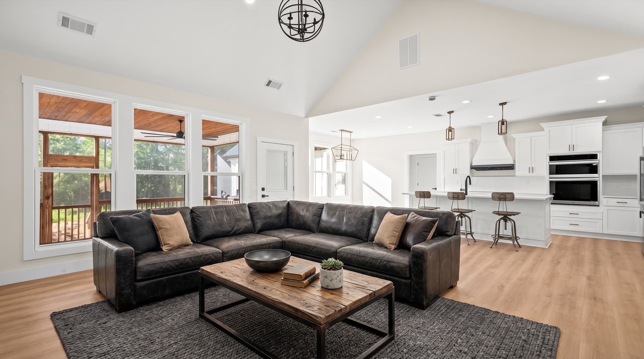 Open-concept living room and kitchen in a Bull Run Construction new build
